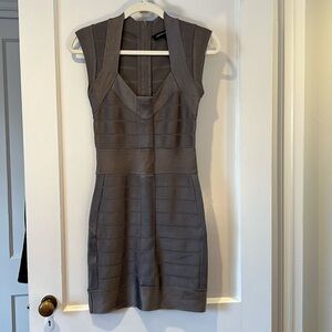 French Connection bandage style bodycon dress. Zipper closure on back.